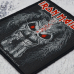 Sew on patch Iron Maiden (Eddie middle candle) in a blister (ofpb-030)
